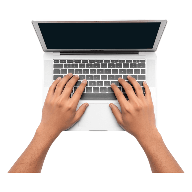 Hands typing on a laptop